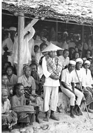 Adat officials watching dances from Baileu.